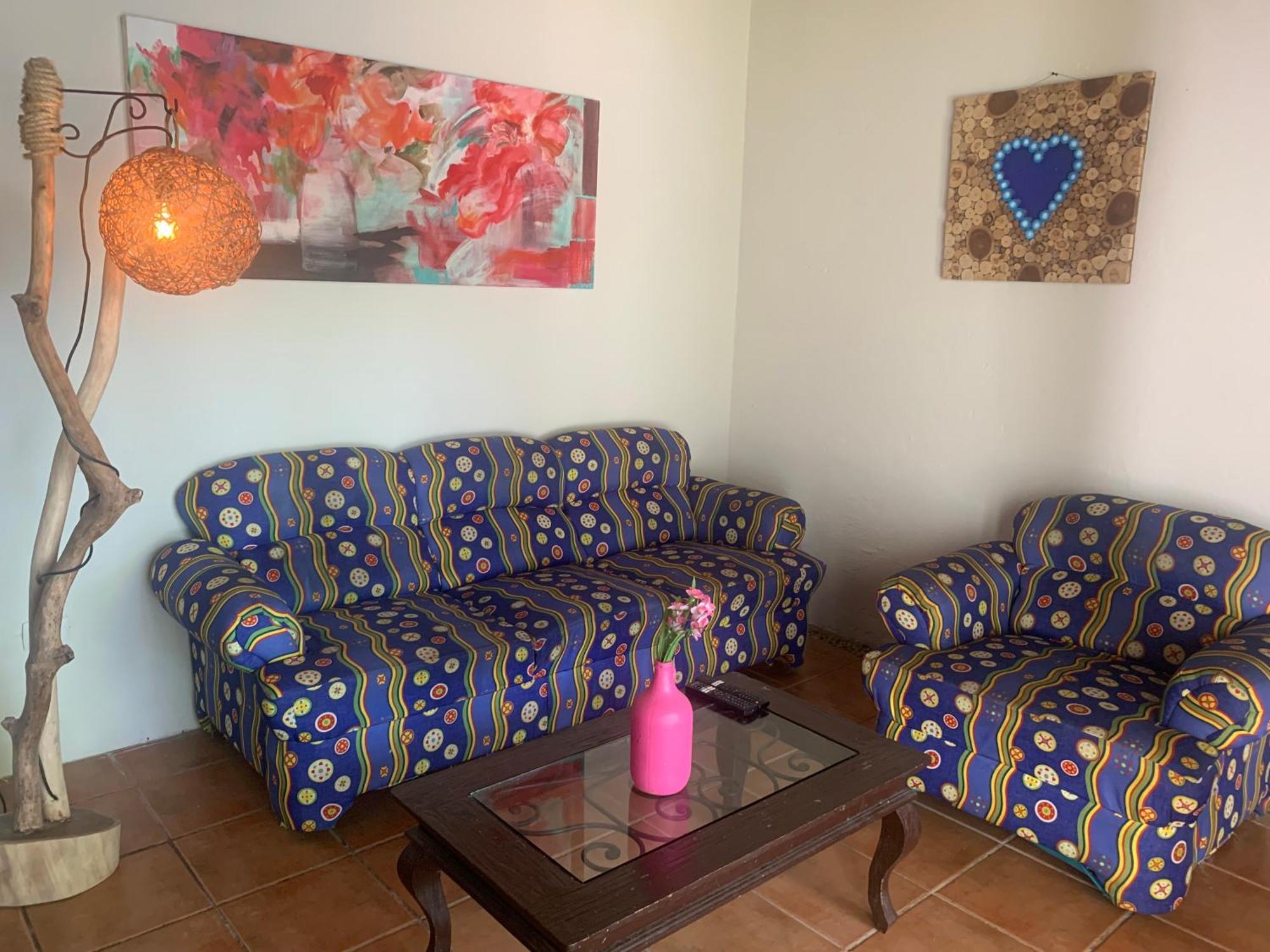 Casa Caribe Cancun Exterior photo A living room with a sofa and a chair